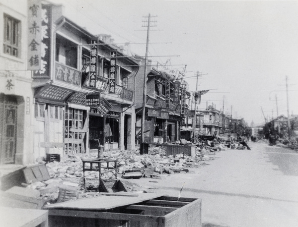 Debris in front of war damaged shops, Shanghai, 1932