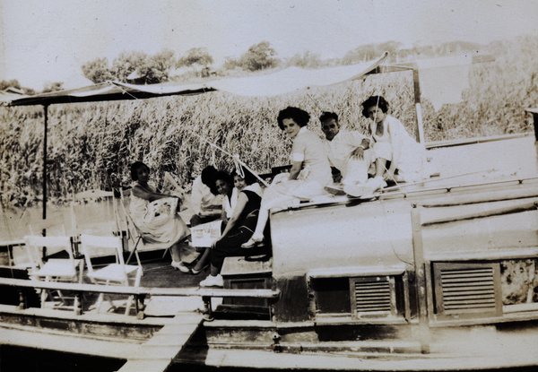 Holiday-makers on a houseboat