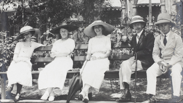 A group on a bench in Victoria Gardens, Tianjin