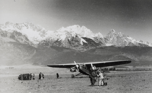 Dr Joseph Rock taking a photograph of the 'Kunming' aircraft, near Lijiang