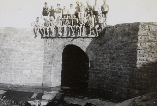 Royal Navy sailors, wearing swimsuits, posed above a watergate, Weihai (威海)