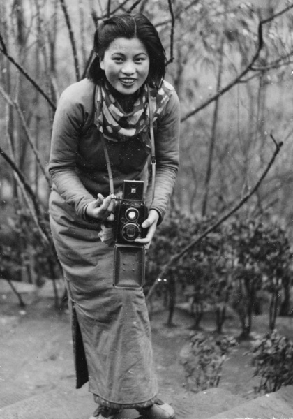 Min Chin with a camera, Northern Hot Springs, 1940