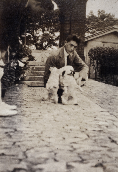 Bill Hutchinson with two small dogs and an unidentified man, 35 Tongshan Road, Hongkou, Shanghai