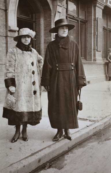 Two women wearing fashionable winter coats and hats, Shanghai