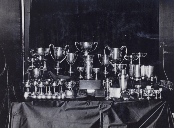 Display of horse racing trophies inscribed to W. G. Crokam