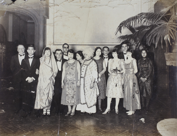 Tom, Sarah, Bill and Mabel Hutchinson at a party with John and Sonia Piry, and other unidentified people, Shanghai