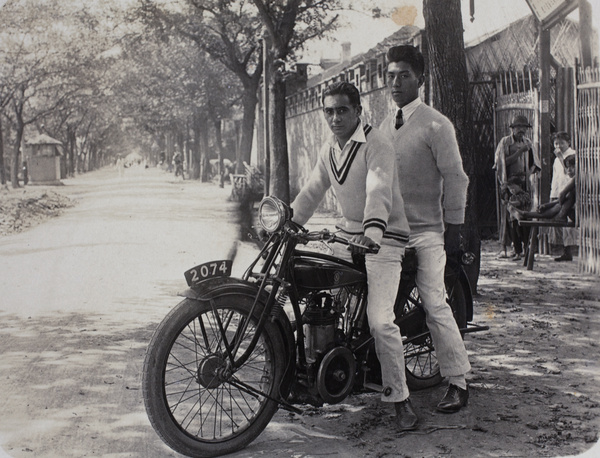 Booby and Harry Hutchinson astride an OK-Supreme motorcycle, Tongshan Road, Hongkou, Shanghai