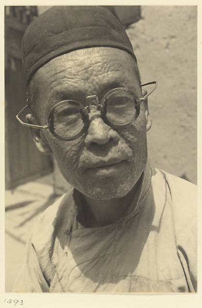 Man wearing eyeglasses and cap