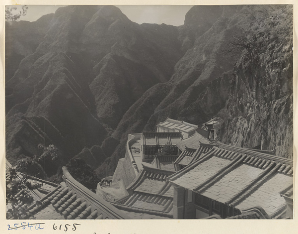 Rooftops of the Sheng mi zhi tang Monastery and mountain landscape