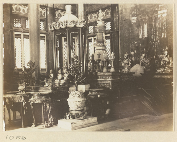 Interior view of Wan fa gui yi dian at Pu tuo zong cheng miao showing altar, stupa-style pagoda, and statues of Bodhisattvas