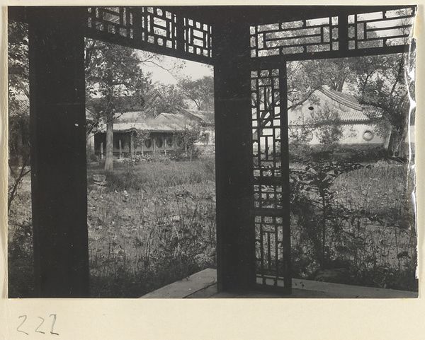 Buildings and half-open covered walkway with ornamental windowns at the Old Wu Garden