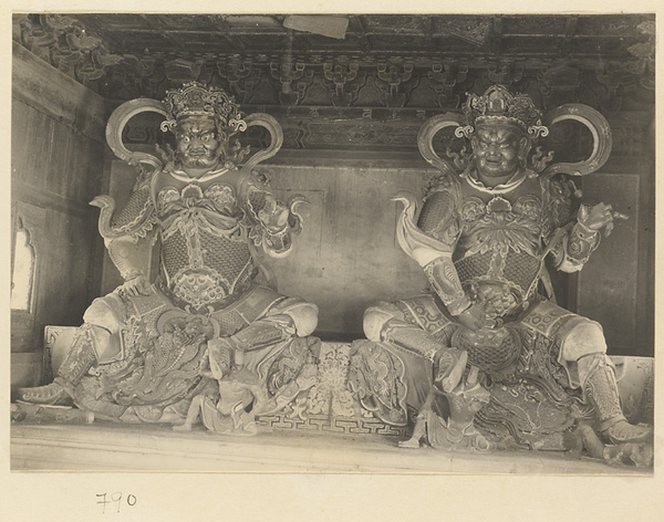 Interior of temple building at Beihai Gong Yuan showing two of the four celestial kings