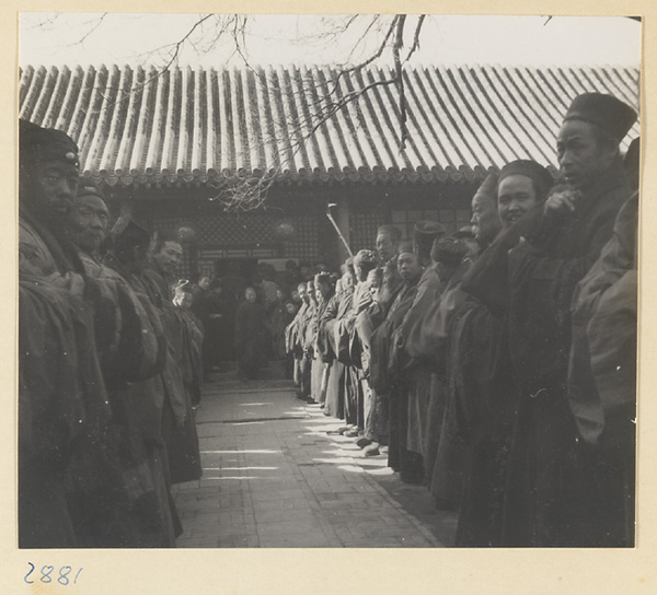 Daoist priests lined up outside Bai yun guan at New Year's
