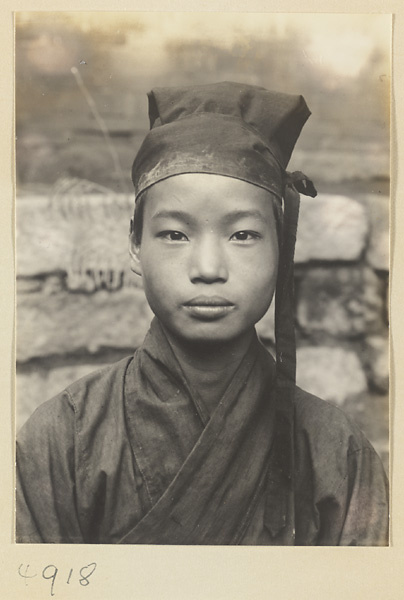 Daoist priest wearing a cap with a streamer knot on Hua Mountain