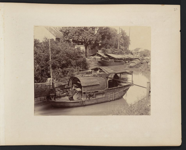 Two Chinese women on sampan on waterway between Shameen Island and north bank of Pearl River, Canton