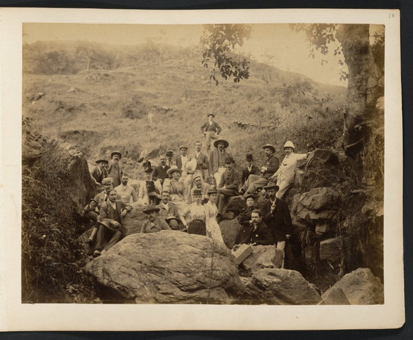 Group of people outdoors posing among large rocks, somewhere near Canton