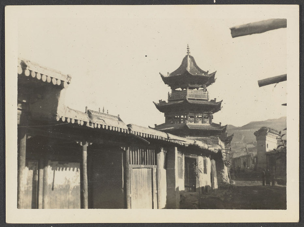 Tsapa, Tsinghai.  A custom station for the suppression of salt smuggling into Tibet.  A southern view of mosque minaret.  Typical houses with flat roofs in foreground.