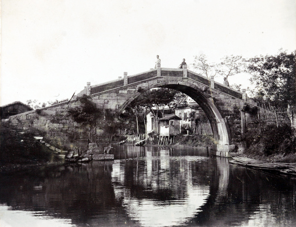River houses viewed through bridge