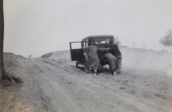 Pushing a car up a hill, near Chentow