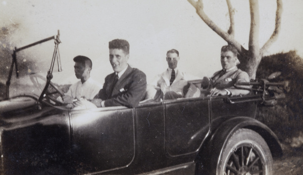 Chinese driver and three passengers in a car on Rubicon Road (Hami Lu), Shanghai