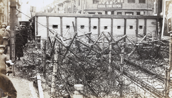Blockhouse and barbed wire barricade across tram tracks, Shanghai