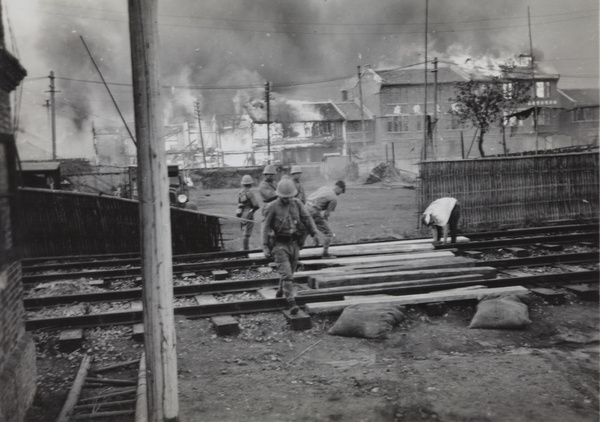 Japanese marines laying a level crossing, near Shanghai North Railway Station, Zhabei, October 1937