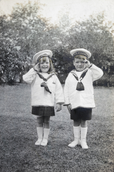 Barbara Symons and Gerald Johns, dressed in sailor suits (HMS Suffolk)