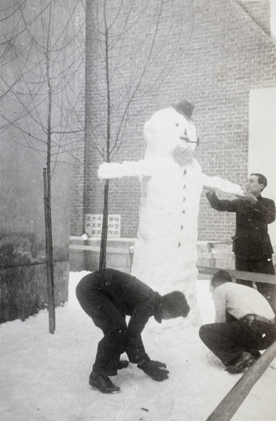 Members of the Java Medical Unit making a snowman, Changsha, 1938