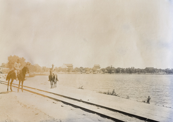 Mounted foreign troops beside the Imperial light railway track, Beihai, Peking
