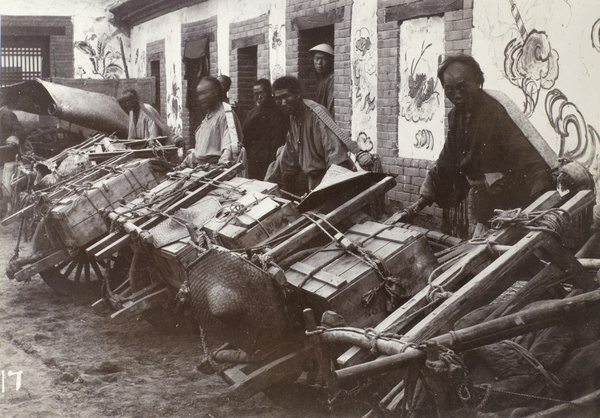Carters with laden wheelbarrows for official British travelling group, Shandong