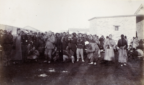 Chinese labourers having their lunch, Hong Kong