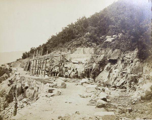 A roadside construction by a rocky hillside, Hong Kong