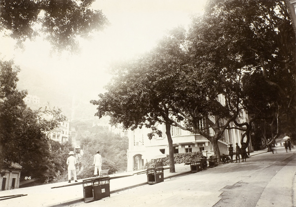 Line of sedan chairs on the side of the road next to the Peak tramway, Hong Kong