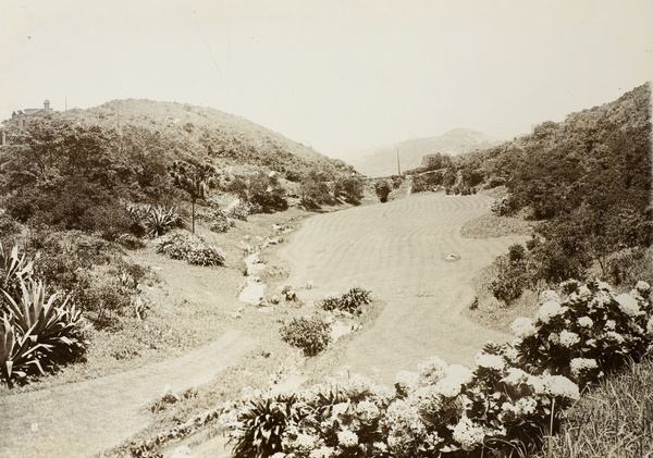 The garden lawn, possibly on the grounds of Mountain Lodge, Hong Kong