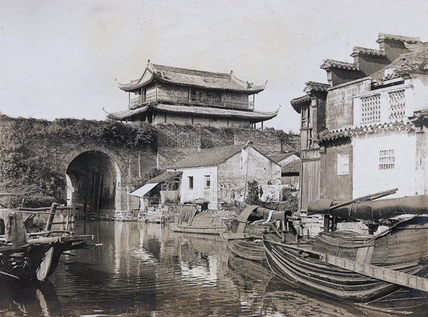 Watergate through city walls and waterside buildings, Suzhou
