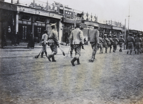 Chinese troops dragging severed heads of looters, Peking Mutiny, 1912