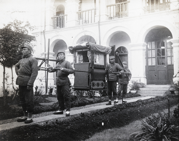 Sedan chair and uniformed bearers