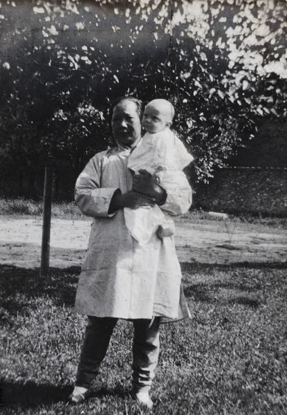 An amah holding a baby