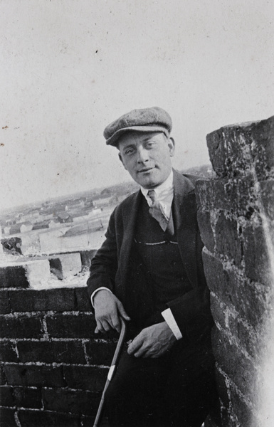 A man standing on a city wall