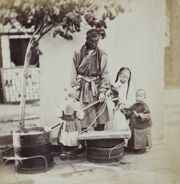 Three children with a pedlar