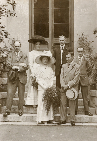 A wedding couple, with guests