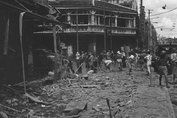 Clearing bomb damage, Nanking Road, Shanghai