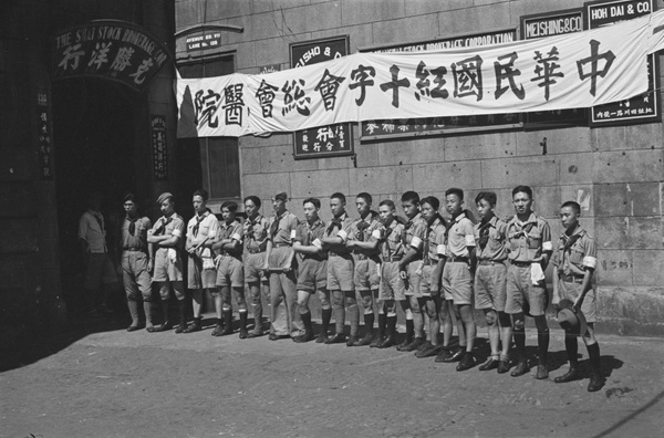Boy scouts outside Shanghai Stock Brokerage Corporation office (serving as a Red Cross hospital), Shanghai
