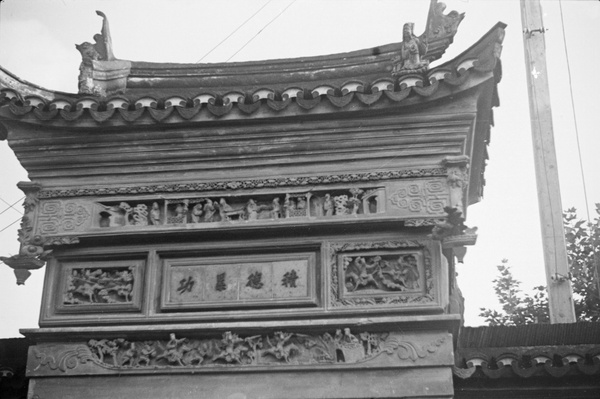 Ornate stone gate with narrative carvings, Shanghai