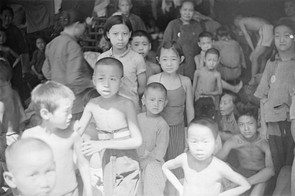Refugee families in a temple, Shanghai