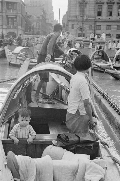 Family in sampan, off The Bund, Shanghai