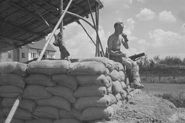 British soldier drinking beer at a guard post, Shanghai