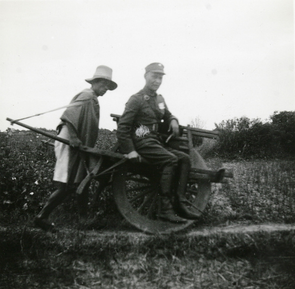 Officer travelling by wheelbarrow