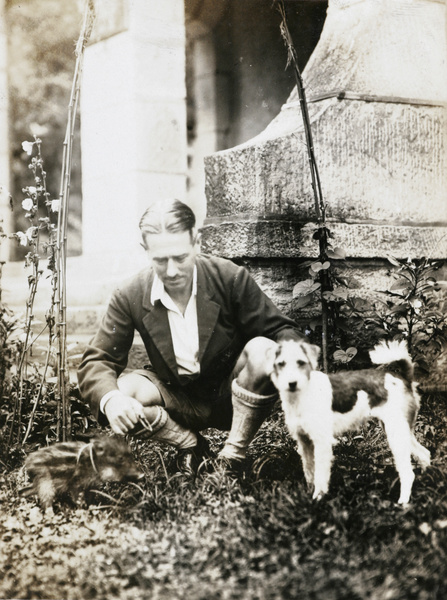 E. E. Wilkinson with a piglet and a dog