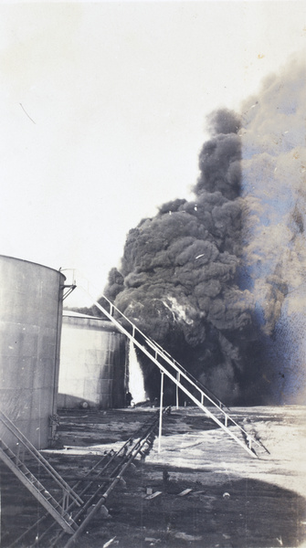 Standard Oil Company holding tank set on fire by a Qing navy shell